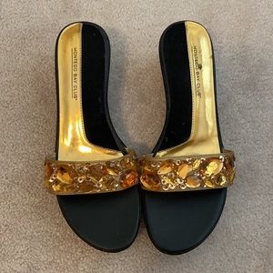 Dress up any outfit with gold jeweled  sandals. Size 7.5.